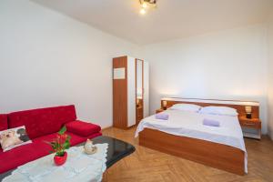 Postel nebo postele na pokoji v ubytování Beach Apartments "Bili Cvitak"