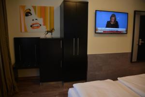 TV a/nebo společenská místnost v ubytování Belle Blue Zentrum