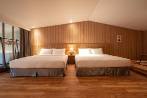 Letto o letti in una camera di Yunoyado Onsen Hot Spring Hotel Deyang