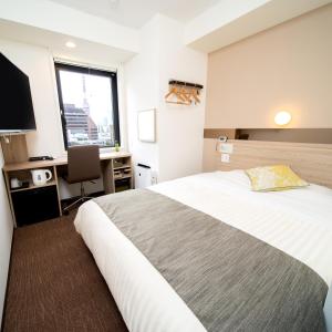 Postel nebo postele na pokoji v ubytování Super Hotel Tokyo Hamamatsucho