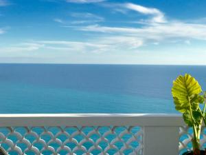 a view of the ocean from the balcony of a resort at Les Lilas in Roquebrune-Cap-Martin