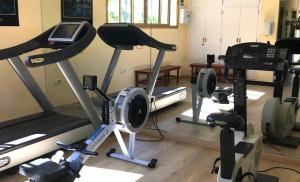 a gym with several exercise equipment in a room at Macdonald Leila Playa Resort in La Cala de Mijas
