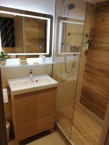a bathroom with a sink and a shower at Hotel Miramar- Cap d'Antibes - La Garoupe plage in Antibes +81 photos