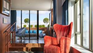 a living room with two chairs and a couch at Hard Rock Hotel Dublin in Dublin