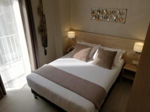 
Un ou plusieurs lits dans un hébergement de l'établissement Hotel Miramar- Cap d'Antibes
