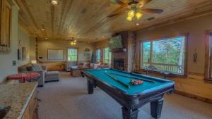 a living room with a pool table in a house at Breathe Inn in Blue Ridge
