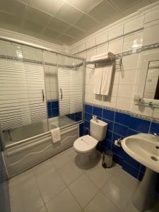 a bathroom with a toilet and a sink at Anzac Hotel in Çanakkale