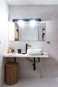 a bathroom with a sink and a mirror at Villa Philippos in Vitalades