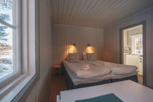 Säng eller sängar i ett rum på Granö Beckasin