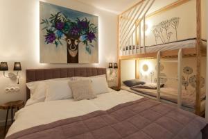 a bedroom with a bed and a bunk bed at Dream Boutique Apartments in Rīga