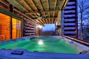 a hot tub in the middle of a house at Forever Joy in Blue Ridge
