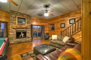 a living room with a couch and a fireplace at Forever Joy in Blue Ridge