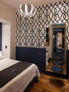 Voodi või voodid majutusasutuse Carlota Sustainable Design Hotel toas
