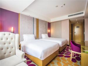 Postel nebo postele na pokoji v ubytování Lavande Hotel Zhanjiang Guomao + 27 fotografií