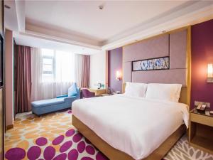 Voodi või voodid majutusasutuse Lavande Hotel Zhanjiang Guomao toas