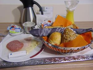 a plate of food on a counter top at Book Hotel Leipzig in Leipzig