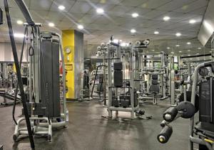 a gym with several rows of tread machines at Benalbeach Premium Small Studio- 24h access in Benalmádena