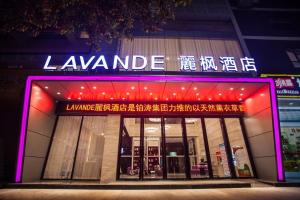 een winkel met een neonbord ervoor bij Lavande Hotels·Guilin MixC in Guilin