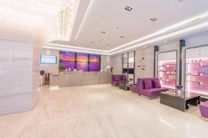 a large room with purple chairs and a salon at Lavande Hotel (Foshan Nanhai Square) in Foshan