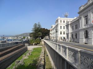 a bridge over a street next to buildings at MAGNA GRECIA B&B in Reggio Calabria