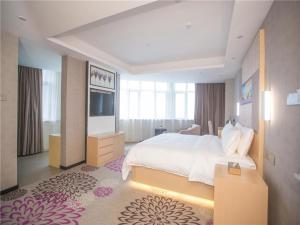 Lavande Hotels·Foshan Nanhai Dali New Metropolis tesisinde bir odada yatak veya yataklar