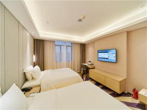 TV a/nebo společenská místnost v ubytování Lavande Hotels·Foshan West Railway Station Luocun