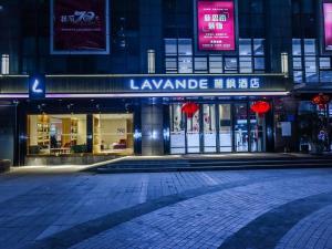 an empty street in front of a building at night at Lavande Hotel Chongqing Nanping Pedestrian Street Convention and Exhibition Center in Chongqing