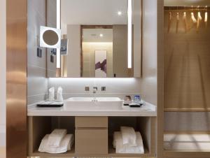 a bathroom with a sink and a mirror at Lavande Hotel National Sun Yat-sen University, Zhuhai in Zhuhai +36 photos