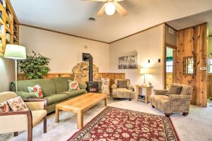 a living room with a couch and a fireplace at La Crescent Cottage on Minnesota Bluffs with View! in La Crescent