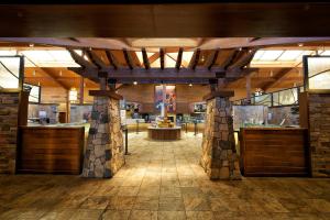 a lobby of a building with a wooden ceiling at Maswik Lodge - Inside the Park in Grand Canyon Village