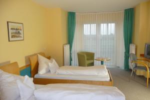 Postel nebo postele na pokoji v ubytování Hotel Bachwiesen