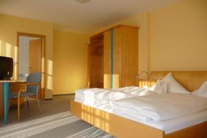 Postel nebo postele na pokoji v ubytování Hotel Bachwiesen