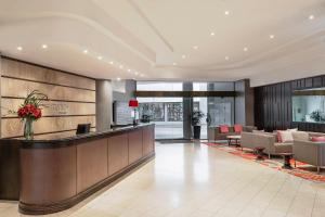 a lobby of a hotel with a reception desk at Mantra on Queen in Brisbane