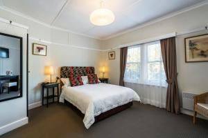 a bedroom with a bed and a window at Ashdowns of Dover in Dover