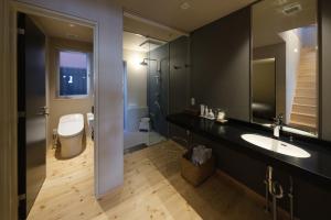 a bathroom with a sink and a toilet at Kamome Jyuku in Takamatsu +30 photos