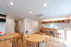 Sjónvarps- og/eða afþreyingartæki á plat hostel keikyu haneda home