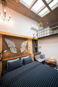 Cama ou camas em um quarto em QBE B&B