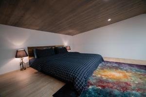 Cama ou camas em um quarto em QBE B&B