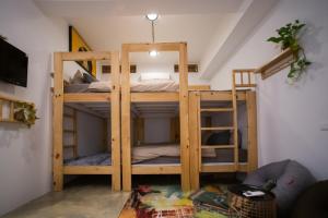 Cama ou camas em um quarto em QBE B&B