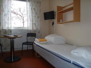 Postel nebo postele na pokoji v ubytování STF Malmfältens Folkhögskola