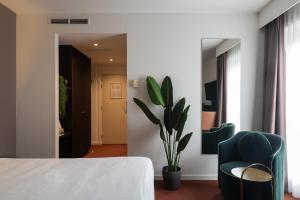 Postelja oz. postelje v sobi nastanitve Ariane Hotel