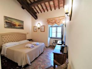 Postel nebo postele na pokoji v ubytování Hotel Terme di Stigliano