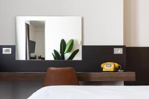 Postelja oz. postelje v sobi nastanitve Ariane Hotel