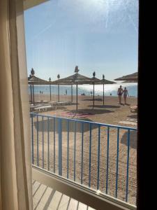 a view of the beach from a balcony at Grand Victoria Hotel in Kyrylivka
