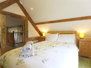 a bedroom with a large bed in a room at The Shooting Folly in Cheswardine