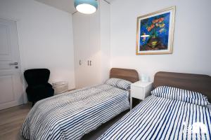 Llit o llits en una habitació de Appartamenti Sole Blu