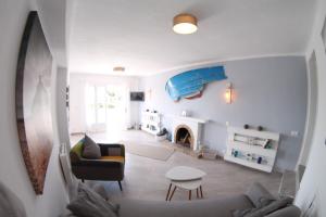 TV a/nebo společenská místnost v ubytování Casa del Mar
