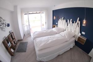 Postel nebo postele na pokoji v ubytování Casa del Mar