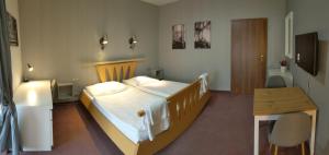 Postel nebo postele na pokoji v ubytování Hotel Antoň