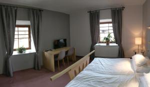 Postel nebo postele na pokoji v ubytování Hotel Antoň
